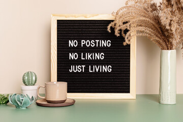 no posting, no liking, just living motivational quote on the letter board. inspiration text for digi