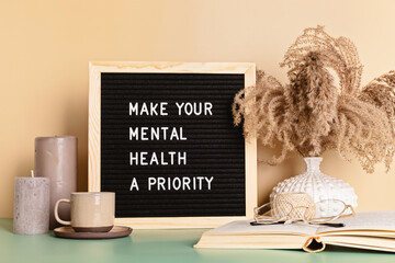 make your mental health a priority motivational quote on the letter board. inspiration psycological 