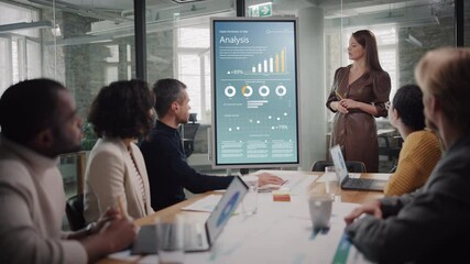 Poster - Project Manager Makes a Presentation for a Young Diverse Creative Team in Meeting Room in an Agency. Colleagues Sit Behind Conference Table and Discuss Business Development, Sales Analysis and Design.