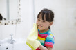 © M-image - young girl washing face by herself  in bathroom