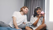 © CameraCraft - Happy young couple saving money into the piggy bank. High quality photo