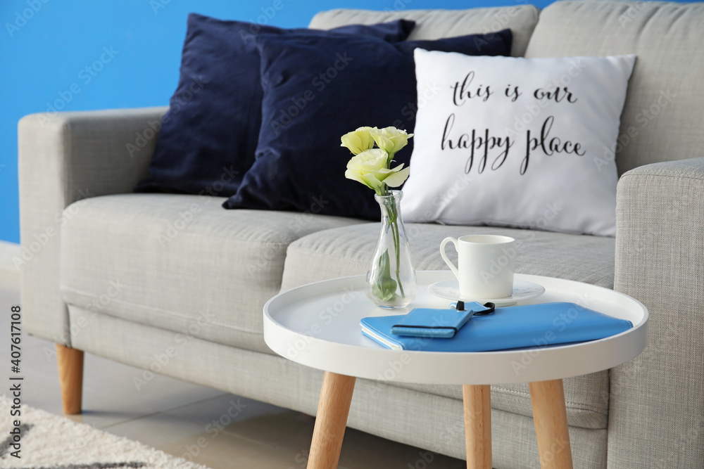 Stylish table and sofa in living room