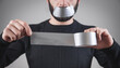 © andranik123 - Caucasian man with tape on mouth. Censorship