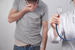 © andranik123 - Doctor holding stethoscope at hospital. Doctor and patient
