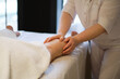 © yavdat - Detail of hands massaging human calf muscle.Therapist applying pressure on female leg. Hands of massage therapist massaging legs of young woman in spa salon. Body care in spa salon for young woman.