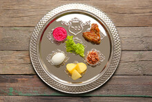 Passover Seder Plate With Traditional Food On Table