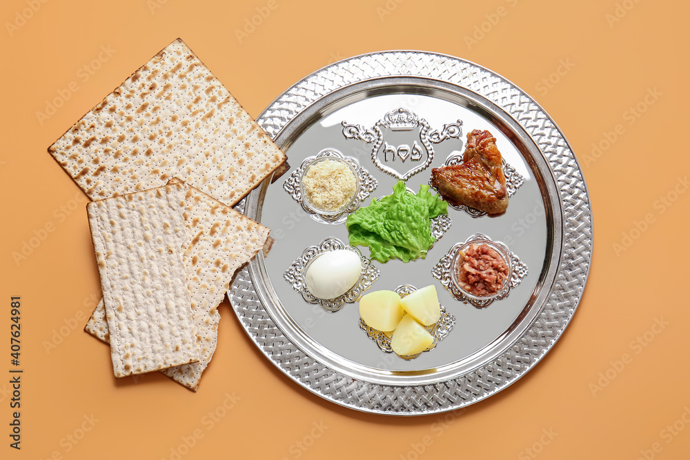 Passover Seder plate with traditional food on color background