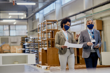 Wall Mural - Company managers communicating while visiting woodworking production facility during coronavirus pandemic.