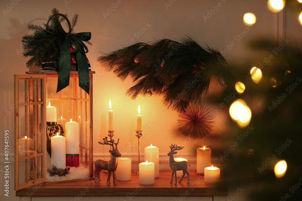Wooden decorative Christmas lantern and burning candles on table indoors - obrazy, fototapety, plakaty 