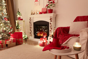 Poster - Living room with fireplace and Christmas decorations. Festive interior design