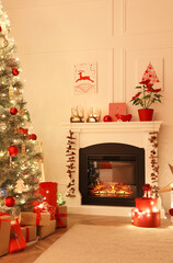 Poster - Living room with fireplace and Christmas decorations. Festive interior design