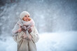 © leszekglasner - Smiling woman enjoying winter among snow outdoor