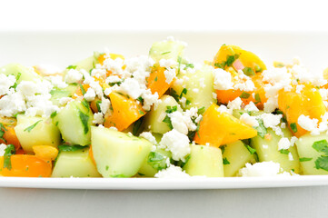 Wall Mural - healthy tomato with cucumber salad served greek-style with feta ch