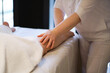 © yavdat - Detail of hands massaging human calf muscle.Therapist applying pressure on female leg. Hands of massage therapist massaging legs of young woman in spa salon. Body care in spa salon for young woman.