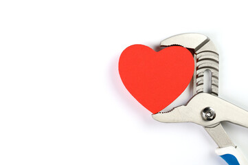 . Wrench with hearts isolated on background. The concept of your favorite profession and Valentine's Day.