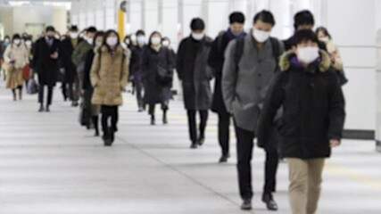 Wall Mural - Crowd of people walking on the street in Tokyo, JAPAN (東京都内の通勤風景)