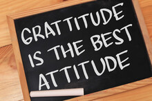 Gratitude Is The Best Attitude, Text Words Typography Written On Chalkboard Against Wooden Background, Life And Business Motivational Inspirational