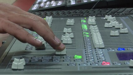 Wall Mural - Established Shot of Lighting Engineer Using Lighting Mixer Console, Light console