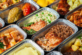 Fototapeta Paryż - Business lunch in eco plastic container ready for delivery.Top view. Office Lunch boxes with food ready to go. Food takes away. Catering, brakfast.
