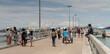 © Aleksandr - Tourists on the pier of pleasure boats