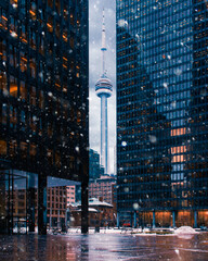 Poster - Beautiful Toronto tower with skyscrapers during snowfall