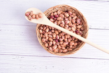 Natural bean grains, Phaseolus vulgaris on wooden background with light veins