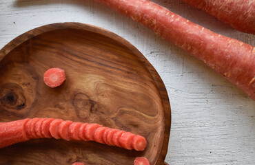 Canvas Print - Closeup shot of fresh carrots on the cutting board