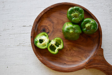 Canvas Print - Closeup shot of fresh peppers on the cutting board