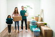 © AntonioDiaz - Portrait of a young family unpacking their furniture