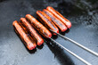 plant-based food, vegan plant-based mock meat sausages on outdoor barbecue
