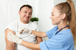 © SHOTPRIME STUDIO - female doctor injecting into man's arm treatment hospital covid