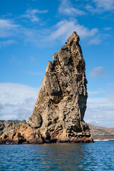 Wall Mural - View of volcanic Pinnacle Rock, Bartolome Island, Galapagos Archipelago, Ecuador. Huge rock on the shore. Favourite Travel destination and famous tourist attraction