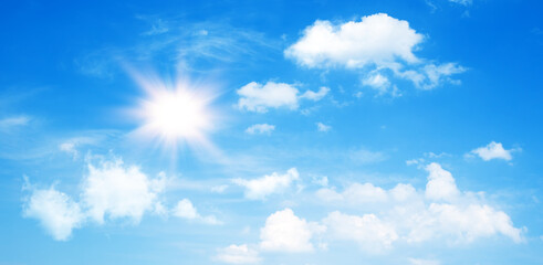 Wall Mural - sunny day background, blue sky with cumulus clouds and summer or spring sun as nature background.