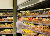 Fototapeta Boho - Supermarket shopping, face mask and gloves,Woman buying fruits at the market.