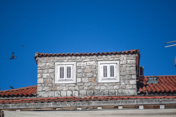 Sticker - Selective focus shot of a residential building with shutters on windows