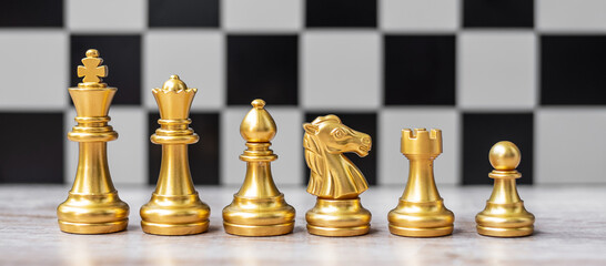 Wall Mural - Gold Chess figure team (King, Queen, Bishop, Knight, Rook and Pawn) on Chessboard against opponent during battle. Strategy, Success, management, business planning, tactic, politic and leader concept