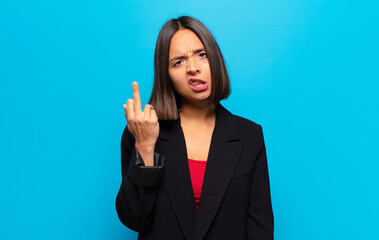 Canvas Print - hispanic woman feeling angry, annoyed, rebellious and aggressive, flipping the middle finger, fighting back