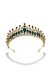 Subject shot of golden tiara adorned with emerald gems and clear sparkling rhinestones that form fanciful pattern. The luxury queen crown is isolated on the white backdrop.
