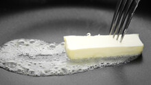 Butter Melting Sizzling In Frying Pan, Close Up