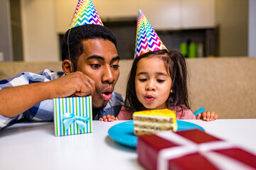 Wall Mural - single father and his little daughter celebration birth day in kitchen