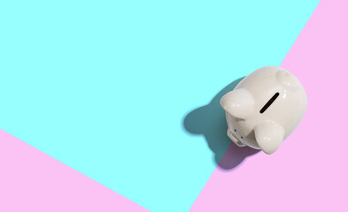 A white piggy bank overhead view flat lay