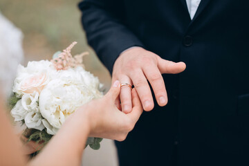 Wall Mural - bride and groom holding hands