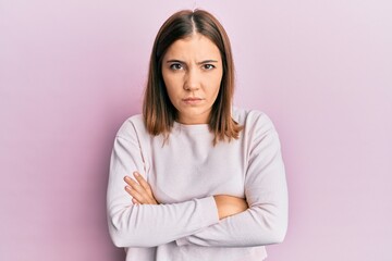 Canvas Print - Young beautiful woman wearing casual clothes skeptic and nervous, disapproving expression on face with crossed arms. negative person.