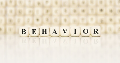 Poster - Word BEHAVIOR made with wood building blocks