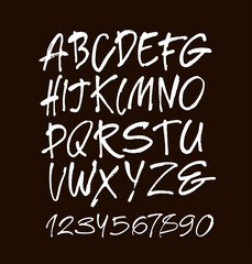 Wall Mural - vector acrylic brush style hand drawn alphabet font. calligraphy alphabet and numbers on a black bac