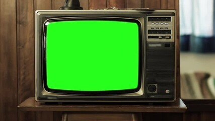 Wall Mural - vintage television set green screen background. zoom in. you can replace green screen with the foota