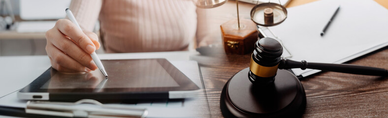 Business and lawyers discussing contract papers with brass scale on desk in office. Law, legal services, advice, justice and law concept .	