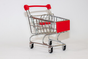 Red toy cart on white isolated background