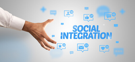 close-up of cropped hand pointing at social integration inscription, social networking concept