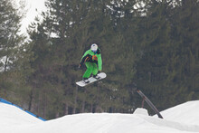 Snowboarder Jumping High Through The Air At The Wisp Ski Resort In Deep Creek Lake Maryland